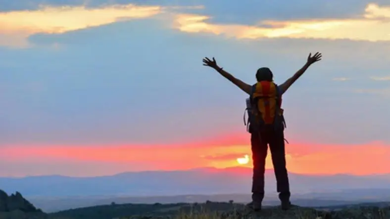 How can I meet new people when traveling alone?